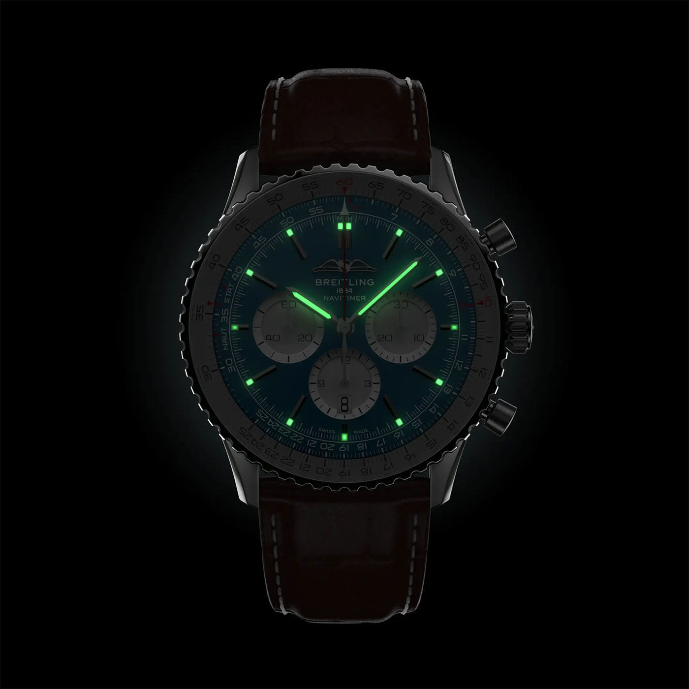 The BREITLING Navitimer B01 Chronograph 46 by Breitling is a luxury watch that showcases a dark face with glowing green markers and three subdials. It is enhanced by an automatic GMT movement and elegantly rests on an alligator leather strap, offering a striking contrast against the black background.