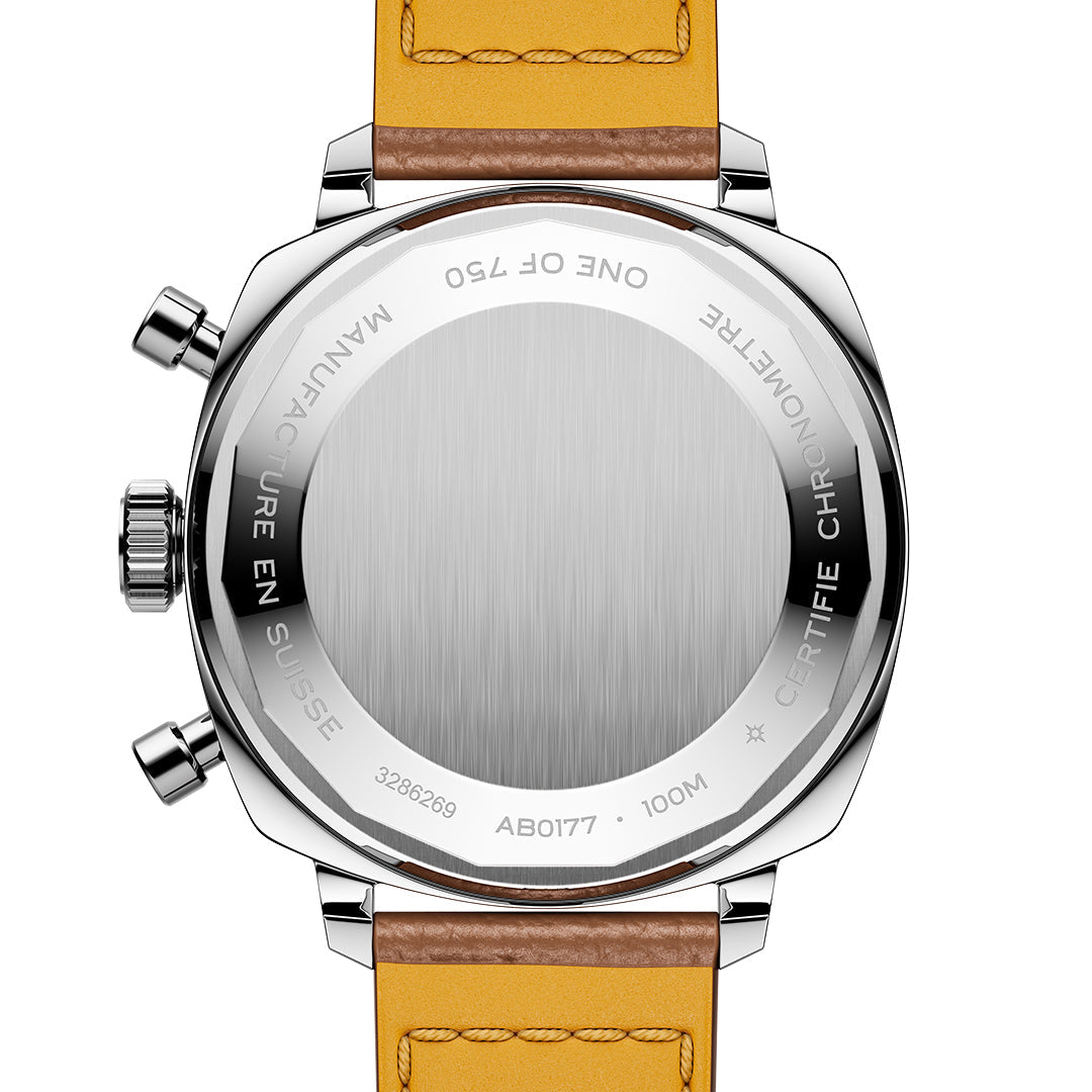 The image features the back of a luxury BREITLING Top Time B01 Racing watch with a vibrant yellow leather strap, blending modern-retro design. The stainless steel back is engraved, marking it as Swiss-made, water-resistant to 100 meters, and part of Breitling's exclusive limited edition.