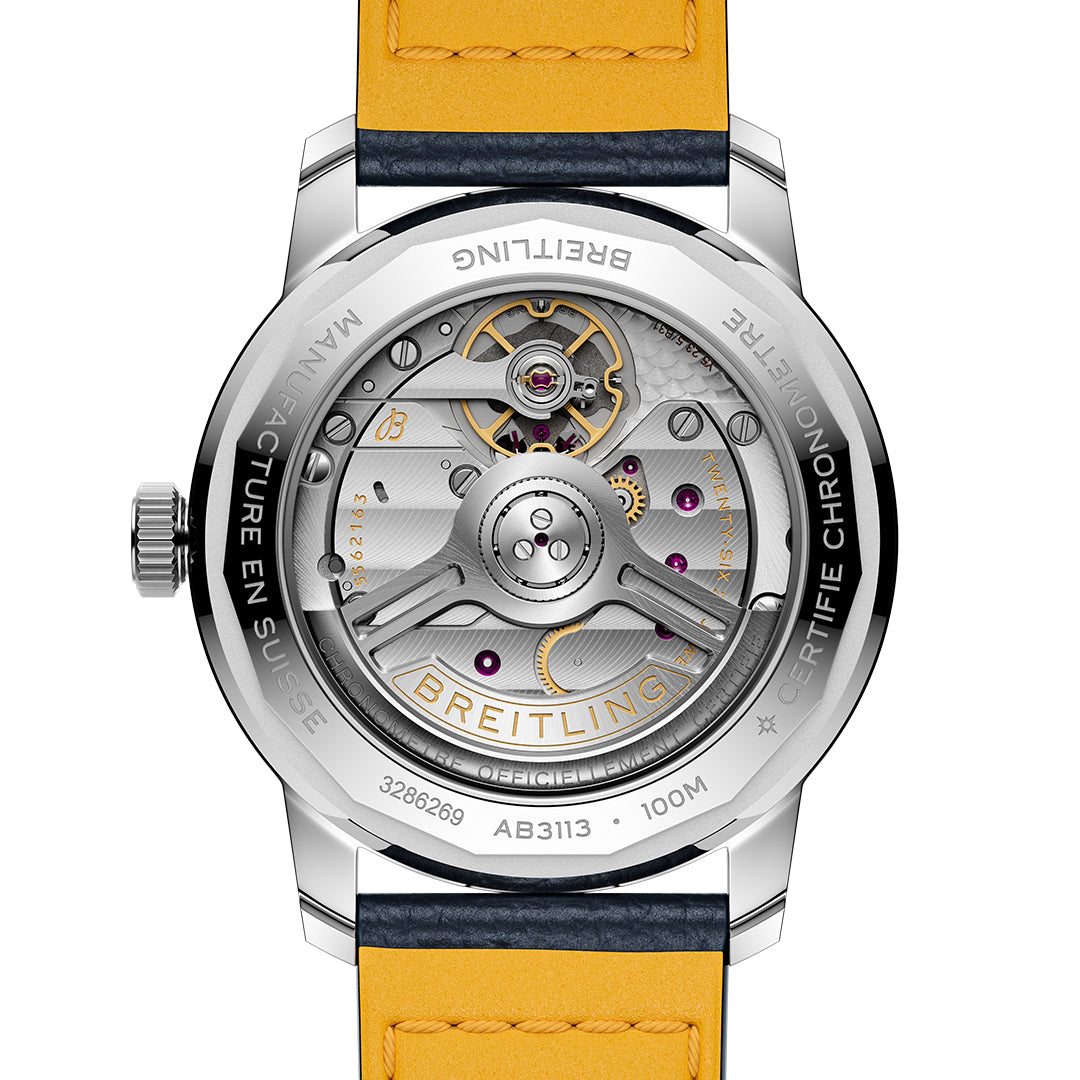 The image presents the back of a BREITLING Top Time B31 38 watch with retro aesthetics, featuring a transparent case revealing intricate silver gears. A yellow strap is partially visible, while engravings on the metallic edge highlight Breitling and the impressive B31 model.