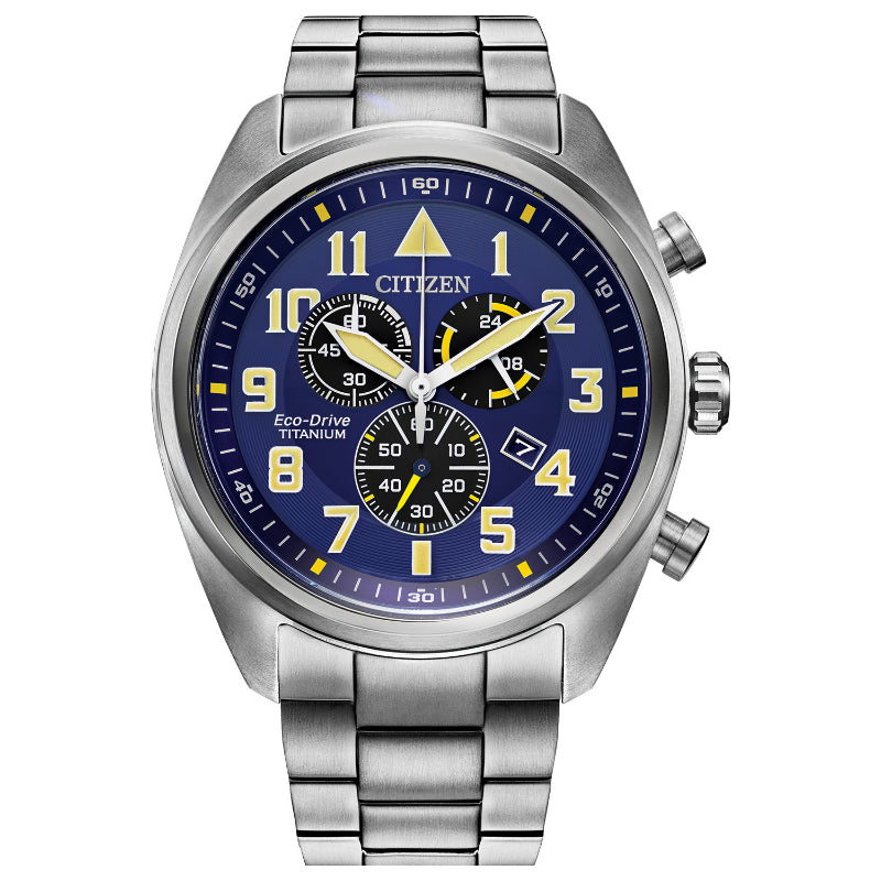 The CITIZEN Garrison Super Titanium Eco-Drive 44mm Watch showcases a durable Super Titanium build with a striking blue dial, enhanced by yellow accents and a stainless steel bezel. This chronograph watch is equipped with three subdials, luminous hands, and white numerals, all complemented by an elegant silver metal band.
