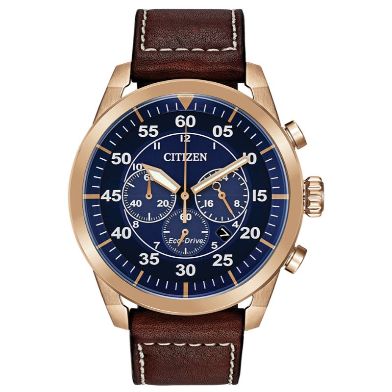The CITIZEN Avion Eco-Drive 45mm Watch blends vintage allure with modern technology, featuring a rose gold watch face with a blue dial and white numerals. Its three sub-dials enhance the design, while a brown leather strap with classic white stitching adds to its elegance. The prestigious "CITIZEN" brand name is prominently displayed on this sophisticated timepiece.