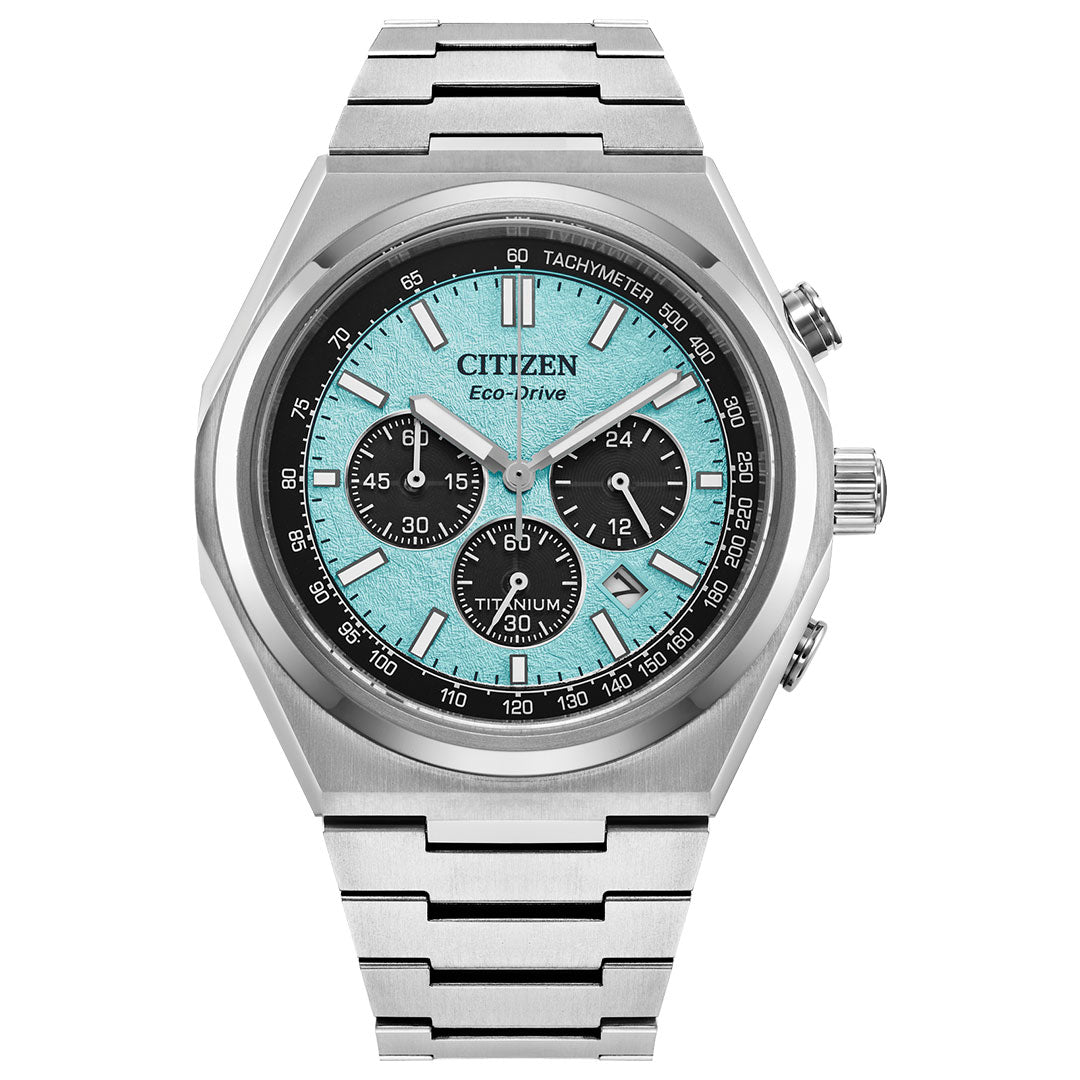 The CITIZEN Forza Chrono Super Titanium Eco-Drive 42.5mm Watch from CITIZEN showcases an Integrated Super Titaniumâ„¢ design complemented by a stainless steel band and case. Its turquoise dial highlights black chronograph subdials along with silver hour markers and hands, while incorporating both a tachymeter and date display for precise timekeeping.