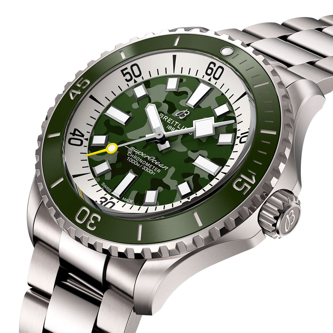 A close-up of the BREITLING Superocean Automatic 46 Super Diver displays its stainless steel case, green bezel, camouflage-patterned dial with white hour markers, yellow-tipped second hand, and prominent Breitling logo.