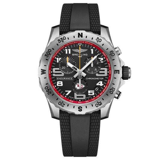 The BREITLING Endurance Pro 44 features a black textured rubber strap, silver bezel with pulsometer scale, black dial, white numerals, red accents, and three subdials.