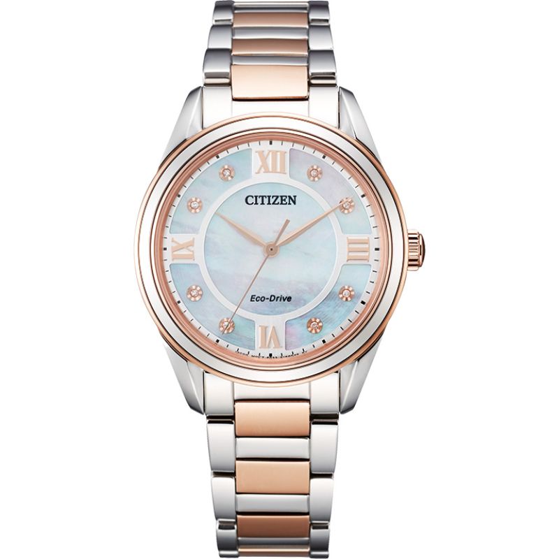 The CITIZEN Fiore Eco-Drive 32mm watch features a two-tone metal band in silver and rose gold. Its round face displays a Mother-of-Pearl dial with rose gold Roman numerals and sparkling diamond hour markers.