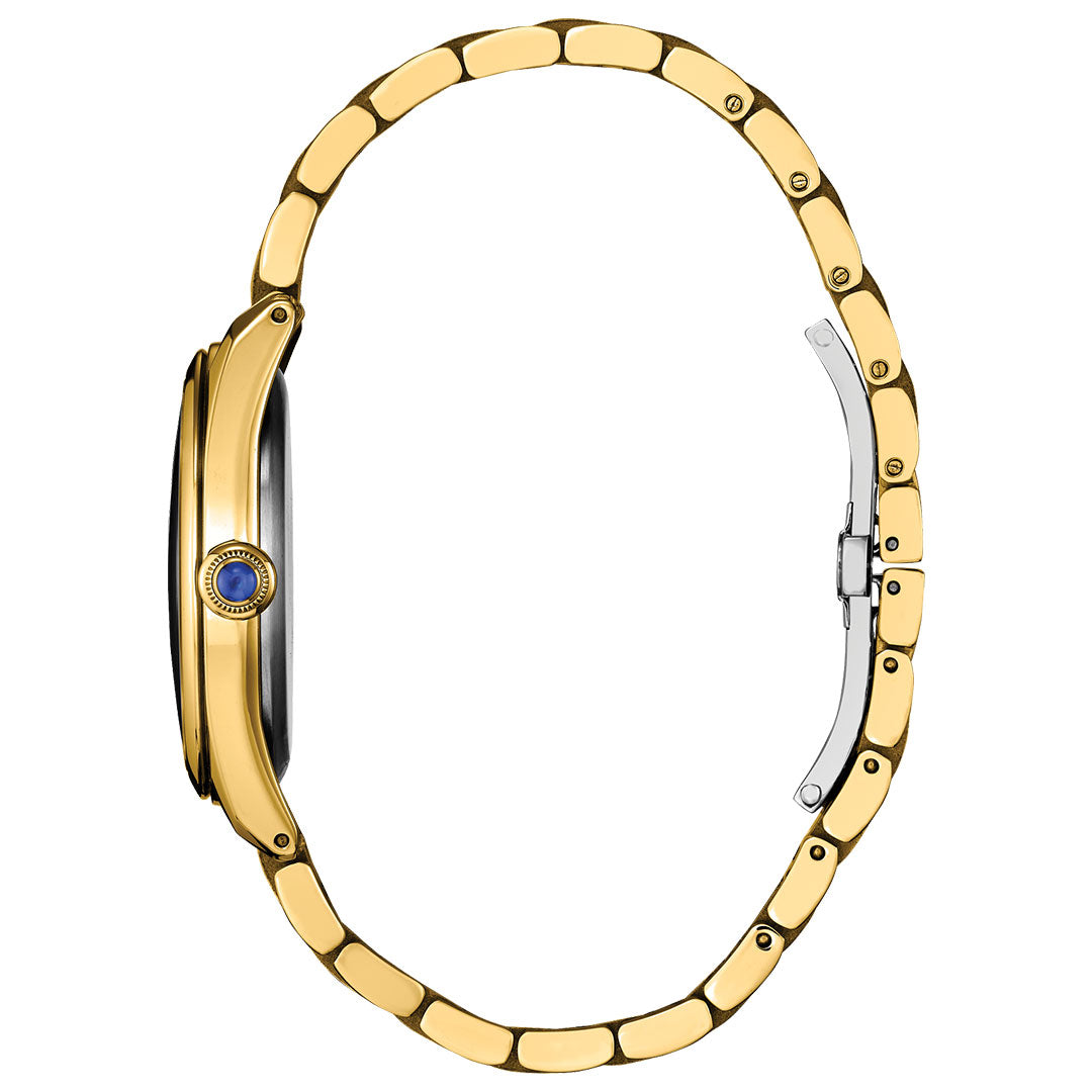 Side view of the CITIZEN L Classic Eco-Drive 33mm Watch by CITIZEN, featuring a gold-tone stainless steel linked band, blue stone-set crown, and partially open clasp against a white background.