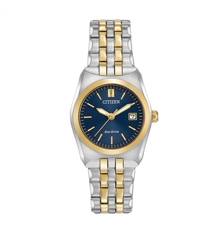 The CITIZEN Corso Eco-Drive 28mm Watch showcases a two-tone stainless steel bracelet in silver and gold. It is crafted with a gold bezel and has a deep blue dial featuring elegant gold hour markers and hands, along with a date display at the 3 o'clock position.