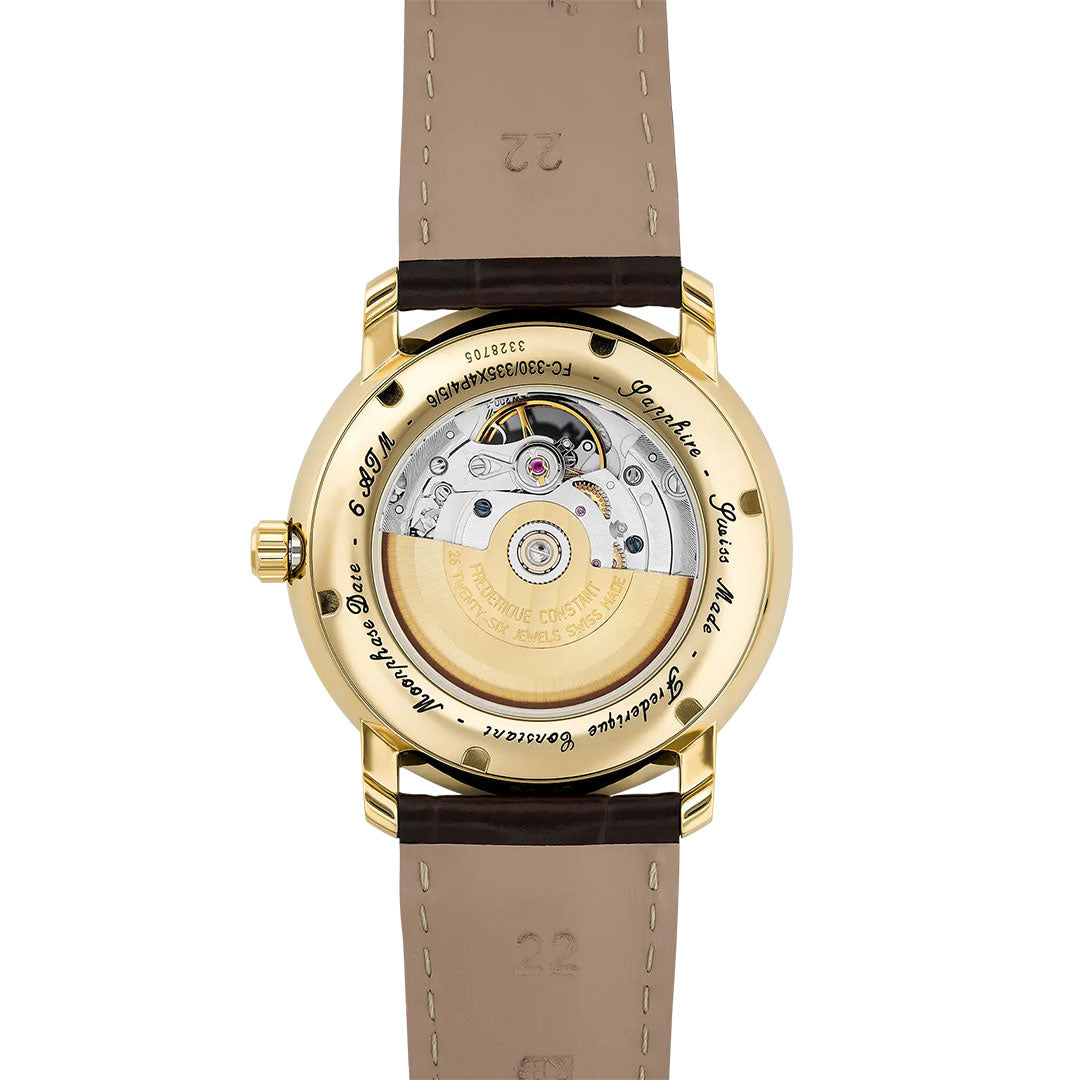 The Frederique Constant Classics Heart Beat Moonphase Date Automatic 40mm Watch features a gold case, transparent case back revealing the automatic movement, a brown leather strap, and engraved text celebrating fine watchmaking.