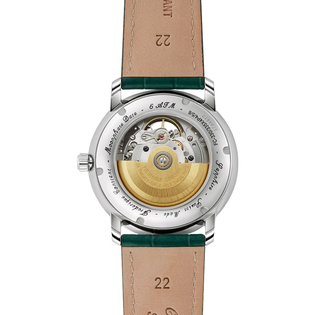 The image features the Frederique Constant Classics Heart Beat Moonphase Date Automatic 40mm Watch, showcasing its transparent caseback with visible mechanical movement and gold-toned rotor, plus a tan leather strap with green accents for modern appeal.