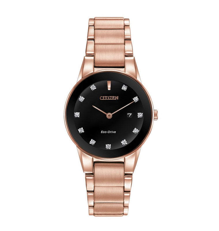 Introducing the CITIZEN Axiom Eco-Drive 28mm Watch from CITIZEN, which showcases a pink gold-tone metal band and case. It features a black dial adorned with crystal hour markers, slender rose gold hands, and includes a small date window located at the 3 o'clock position.