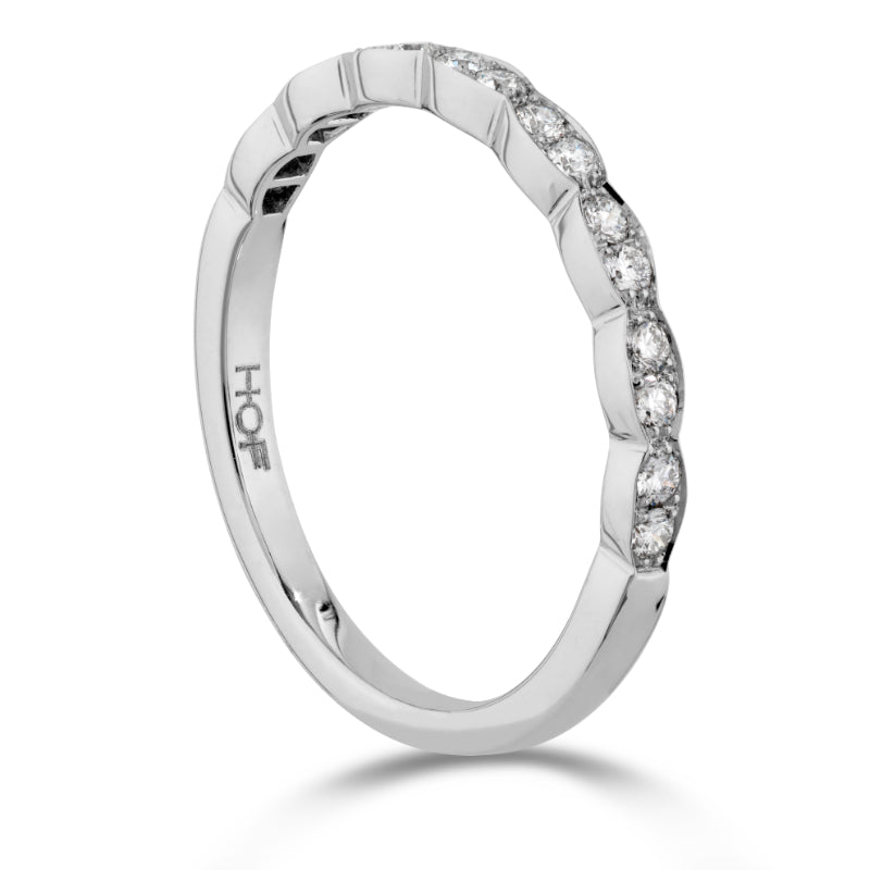 Introducing the Hearts On Fire Lorelei Floral 18K White Gold Round Brilliant Diamond Anniversary Ring. This exquisite piece features a scalloped design adorned with small, sparkling round diamonds along the top half. Crafted from 18 Karat White Gold, it offers a sleek and elegant appearance synonymous with the Hearts on Fire brand.