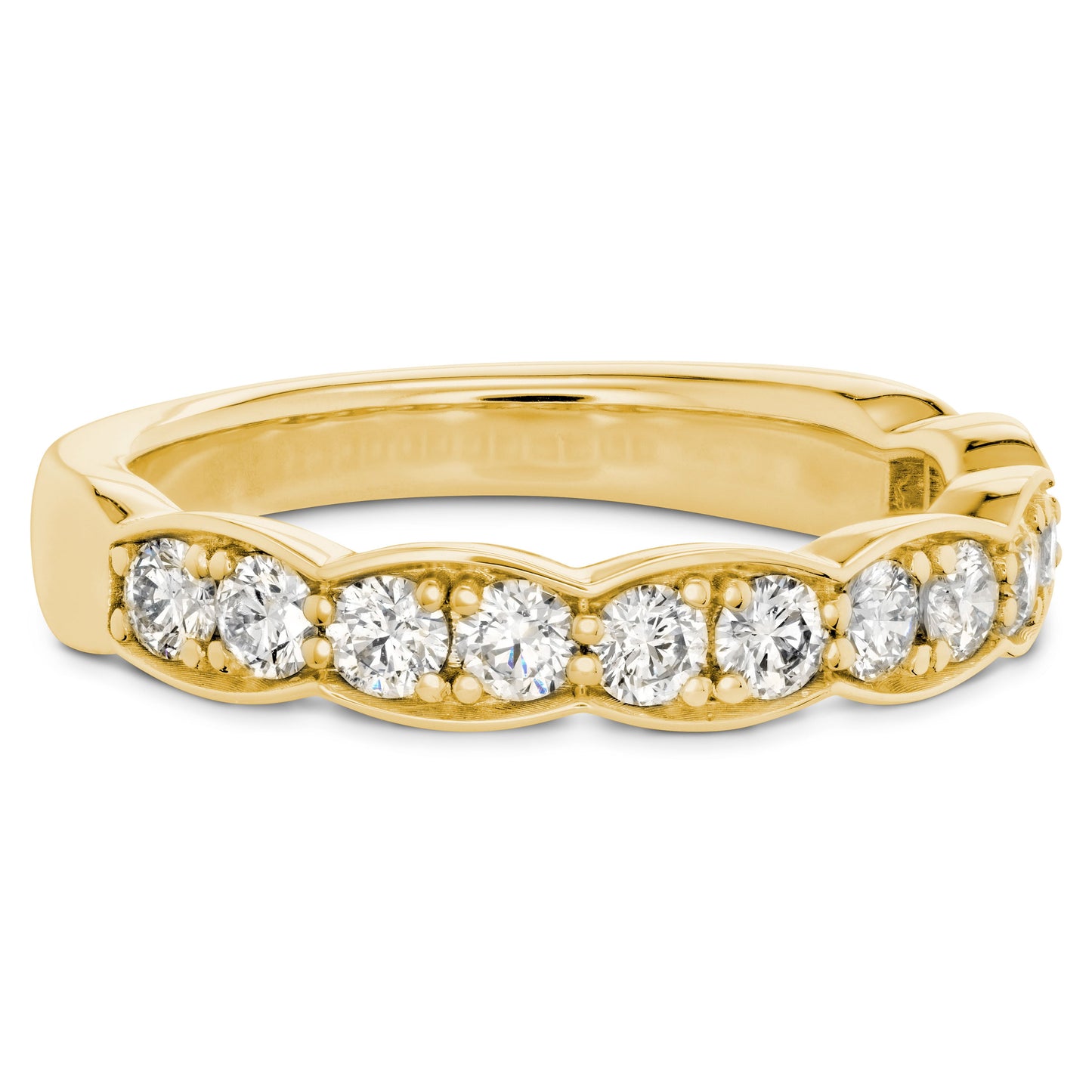 The Hearts On Fire Lorelei Floral 18K Yellow Gold Round Brilliant Diamond Anniversary Ring is a breathtaking wedding band featuring a row of round, dazzling diamonds arranged in a scalloped pattern. Crafted by Hearts on Fire from 18 karat yellow gold, the ring's beautifully cut and evenly spaced diamonds exude luxury and elegance.