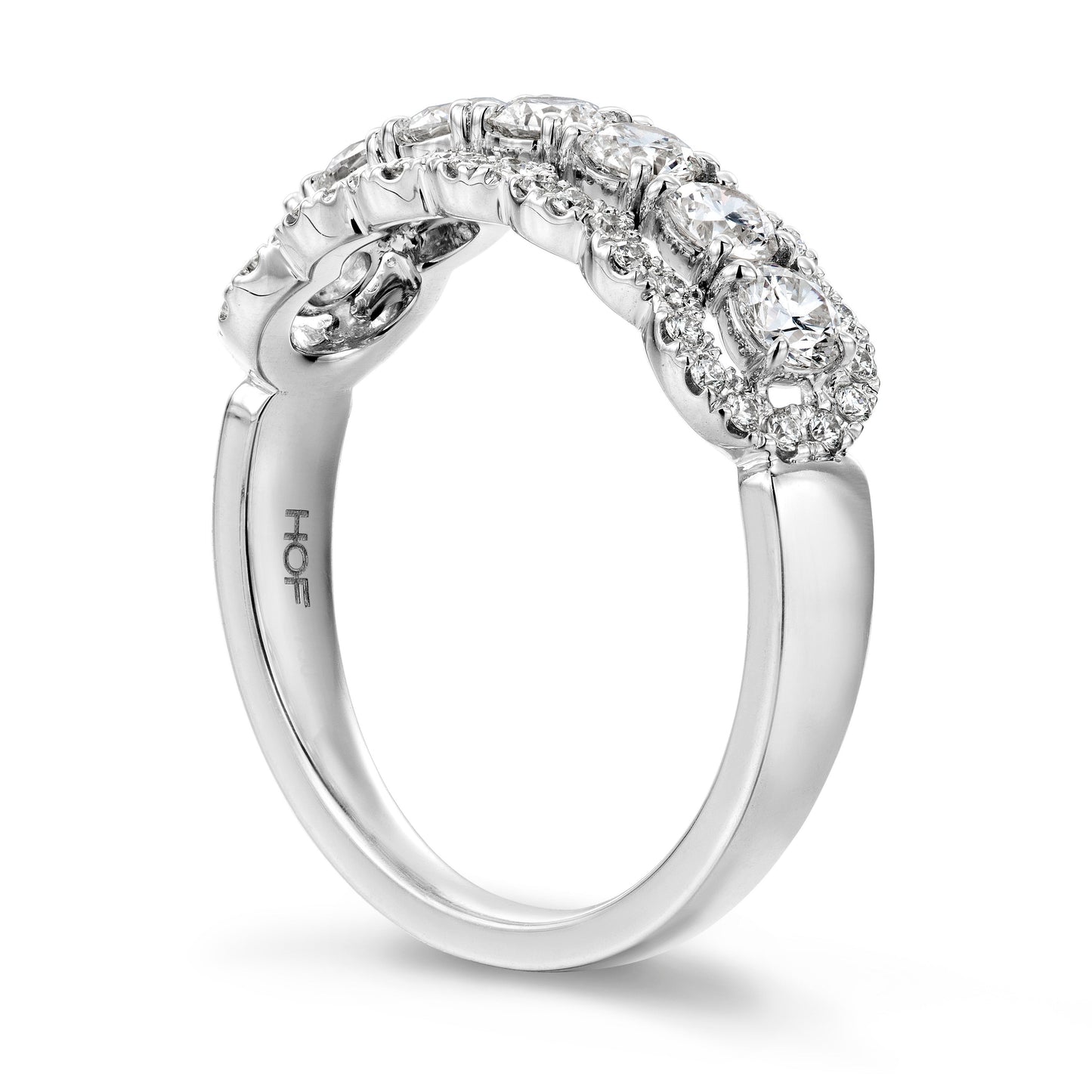 Introducing the Hearts On Fire Aurora 18K White Gold Round Brilliant Diamond Fashion Ring from Hearts on Fire. This exquisite silver ring features intricate detailing and a row of sparkling round brilliant diamonds. The band, crafted from 18 Karat white gold, boasts a smooth and polished finish that radiates elegance.