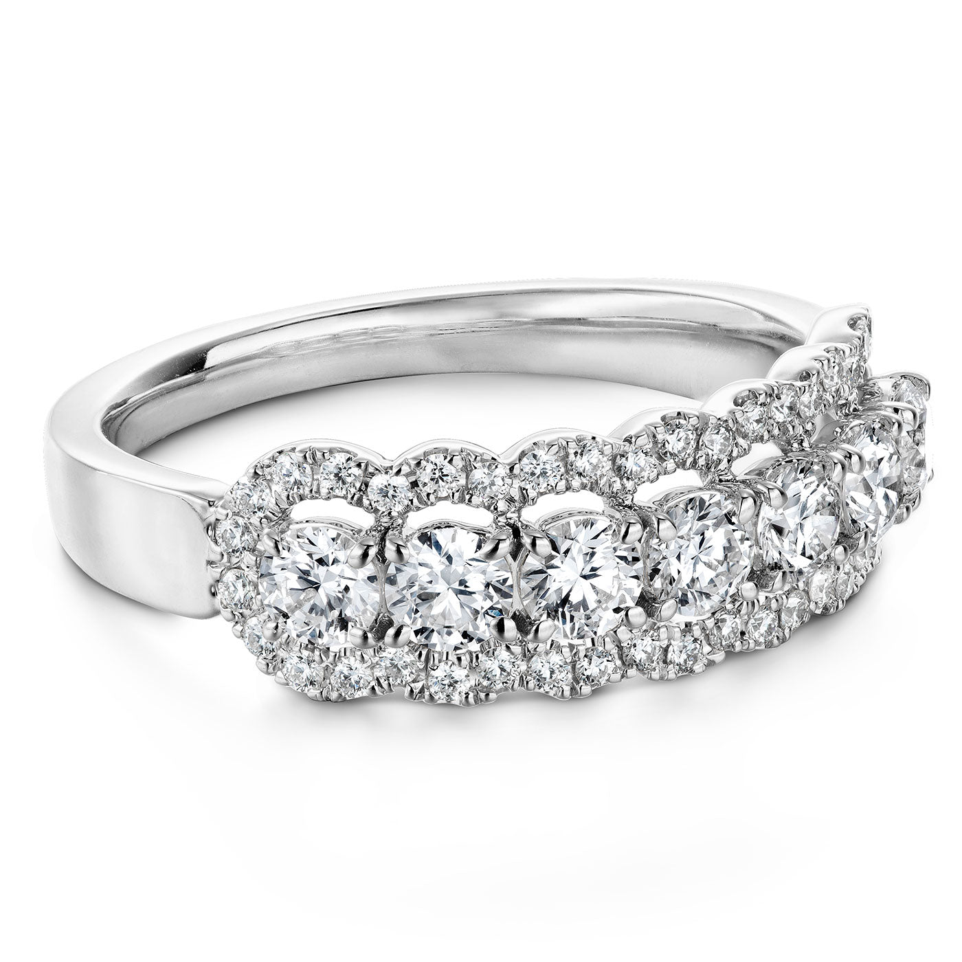 The Hearts On Fire Aurora 18K White Gold Round Brilliant Diamond Fashion Ring by Hearts on Fire features a sophisticated design with round, sparkling diamonds set in a double-row configuration, enhanced by smaller diamonds surrounding the central stones for an intricate and elegant pattern.