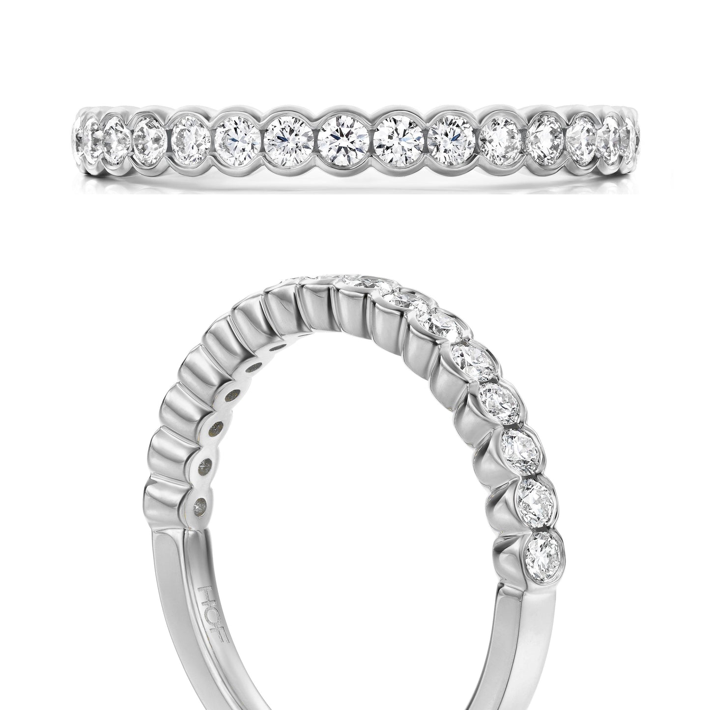 Presenting the exquisite Hearts On Fire Isabelle 18K White Gold Bezel Round Brilliant Diamond Anniversary Ring, crafted with exquisite precision by Hearts on Fire. This elegant piece showcases a continuous design of white diamonds in bezel settings encircling the band. Displayed from a side and angled top view, this ring exemplifies exceptional craftsmanship—perfect for marking your special day.