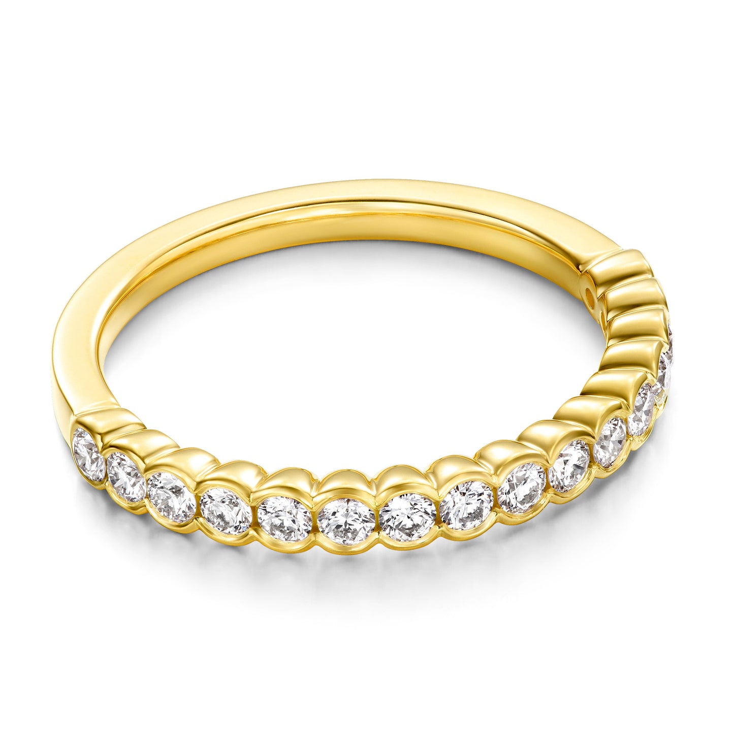 The Hearts On Fire Isabelle 18K Yellow Gold Bezel Round Brilliant Diamond Anniversary Ring showcases a series of round, sparkling diamonds. Each diamond is elegantly nestled in a smooth bezel setting, creating a stunning shimmer against the white background and highlighting its sophisticated design.