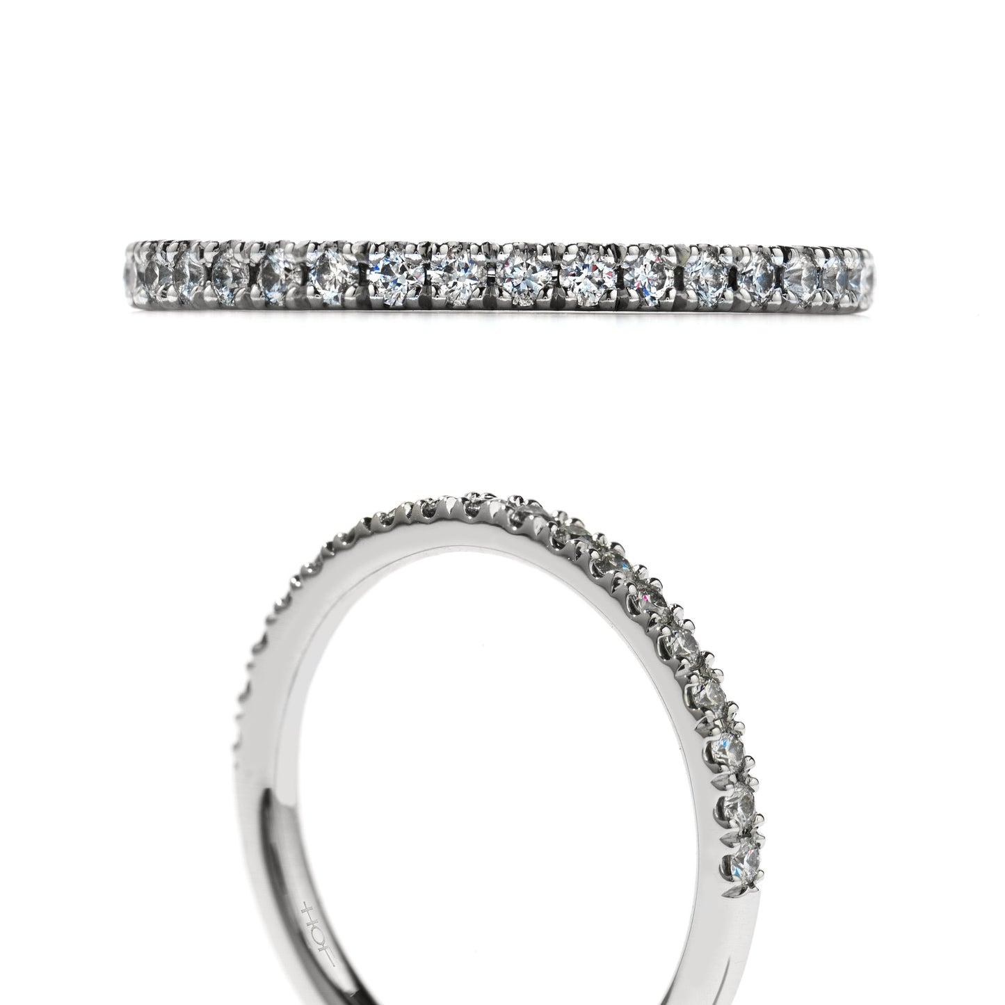 A close-up of the Hearts On Fire Transcend Platinum Round Brilliant Diamond Anniversary Ring, crafted in platinum and exhibiting a continuous row of sparkling diamonds. This exquisite ring is showcased from both a top and angled side view, highlighting its exceptional craftsmanship by Hearts on Fire.