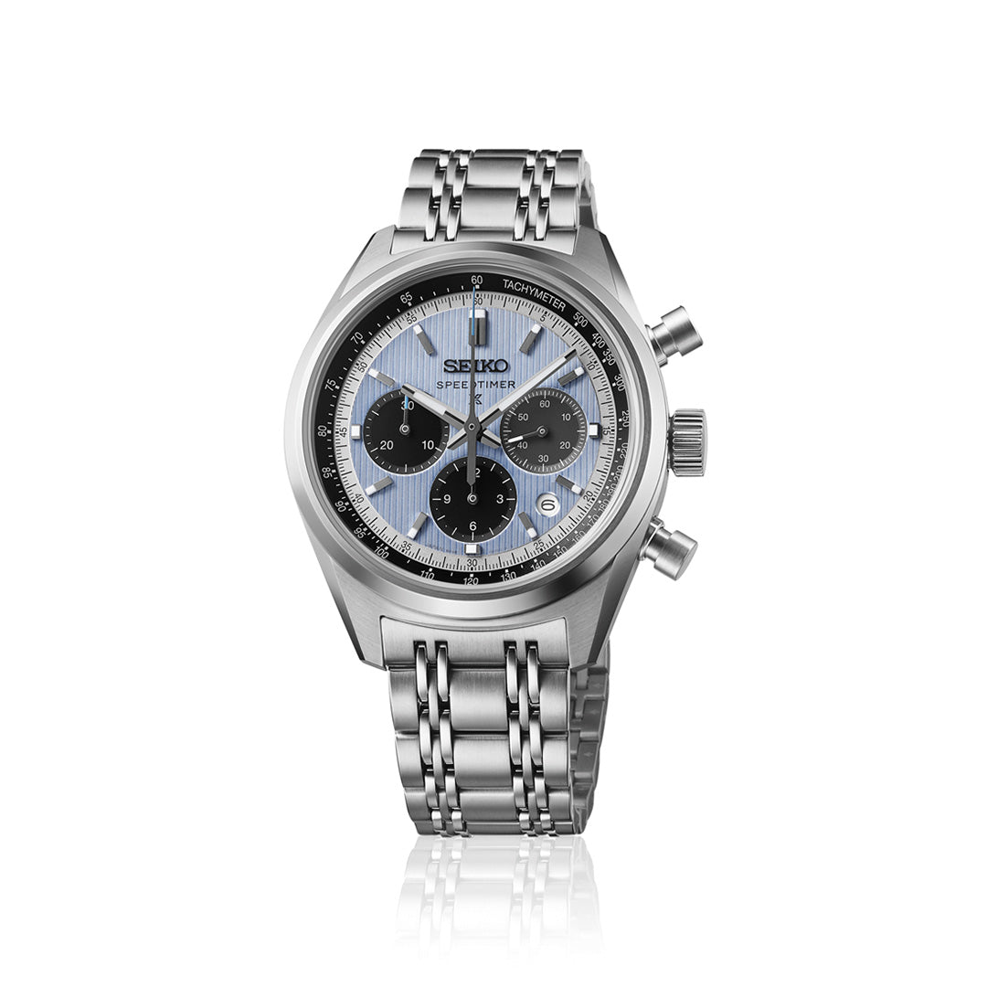 Featuring a chronograph function, the Seiko Prospex Speedtimer Automatic With Manual Winding 42mm Watch by Seiko showcases a silver metal band, a light blue textured dial, three black sub-dials, and a date window positioned at 4 o’clock.