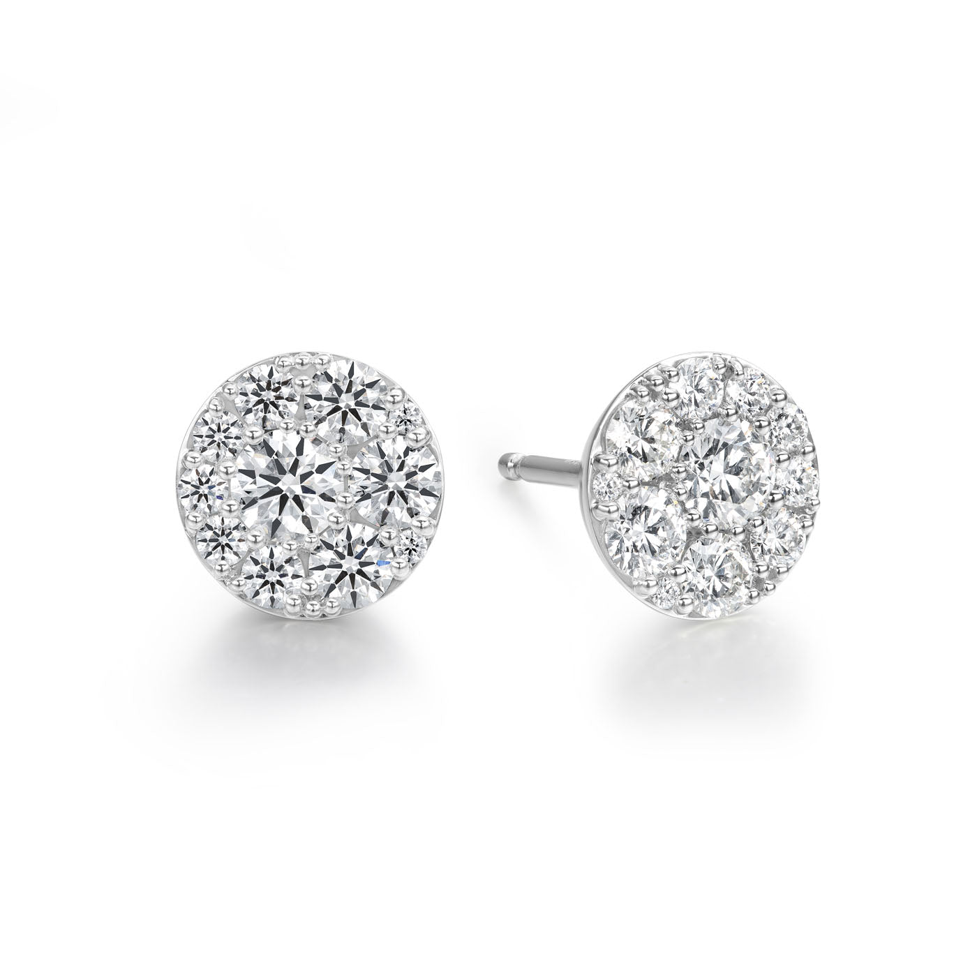 Introducing the Hearts On Fire Tessa 18K White Gold Earrings, a stunning pair of diamond earrings from Hearts on Fire. Each earring features a cluster of round, dazzling gemstones meticulously arranged in a circular pattern. These enchanting pieces are set in 18K white gold and beautifully displayed against a simple white background.