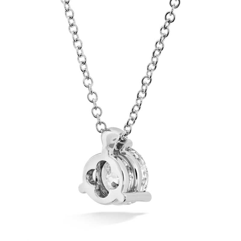 The Hearts On Fire HOF Classic Solitaire Necklace is an exquisite piece from Hearts on Fire, featuring a sleek white gold pendant with a polished circular design and open cut-out elements. Its minimalist aesthetic is perfectly complemented by the accompanying chain.
