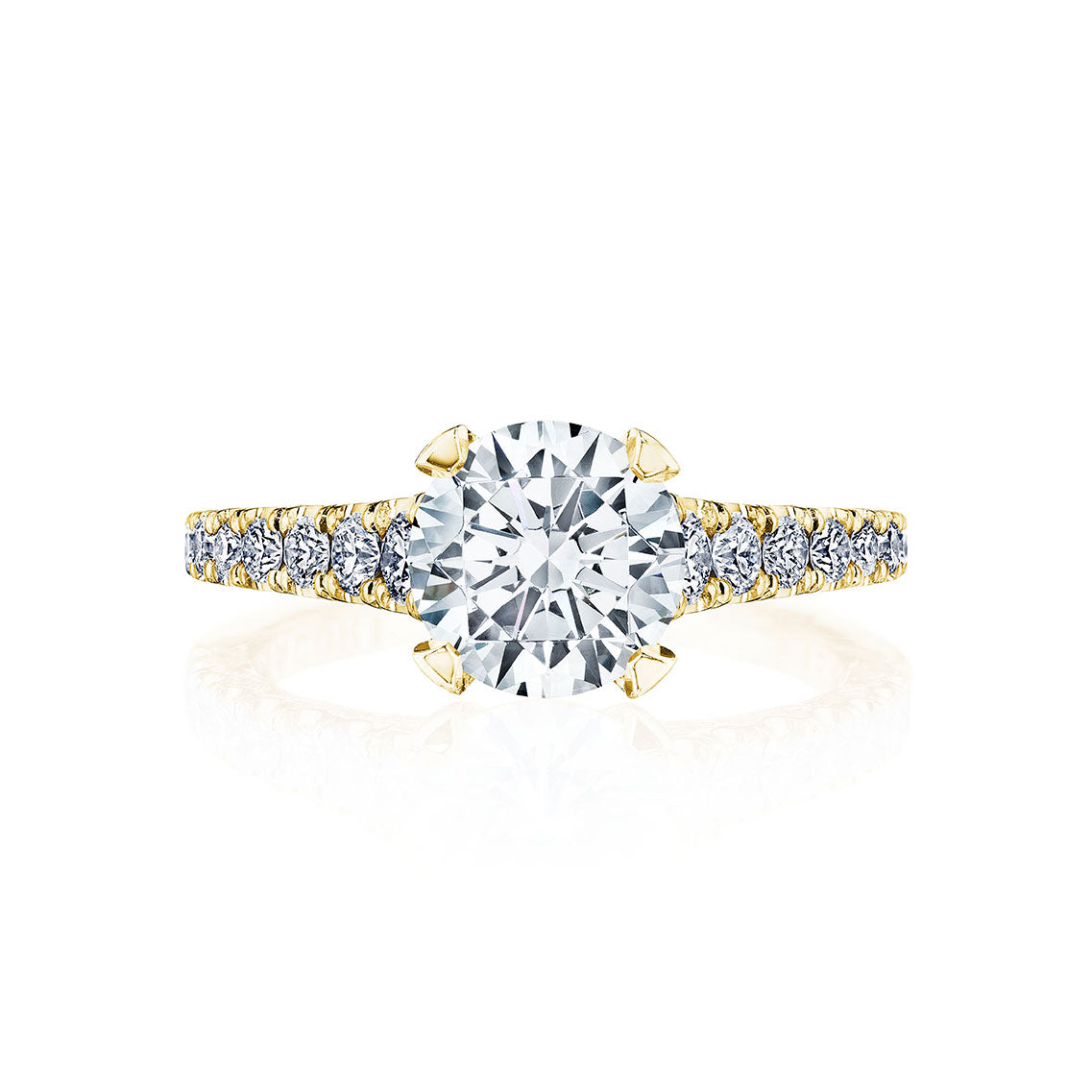 The Tacori Petite Crescent 18K Yellow Gold Round Brilliant Solitaire Semi Mount with Diamond Band Engagement Ring is showcased. The ring features a large round centerpiece, complemented by a diamond-encrusted band that enhances its elegant and luxurious appearance. Displayed against a white background, the ring's sparkling features are truly highlighted.