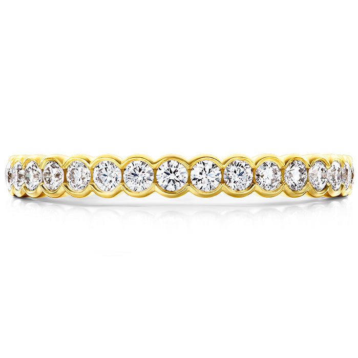 Introducing the Hearts On Fire Isabelle 18K Yellow Gold Bezel Round Brilliant Diamond Anniversary Ring, which elegantly showcases a row of round, brilliant diamonds encircling the band. Crafted in 18 karat yellow gold, the evenly spaced diamonds create a continuous sparkle with subtle glimpses of gold between each stone.