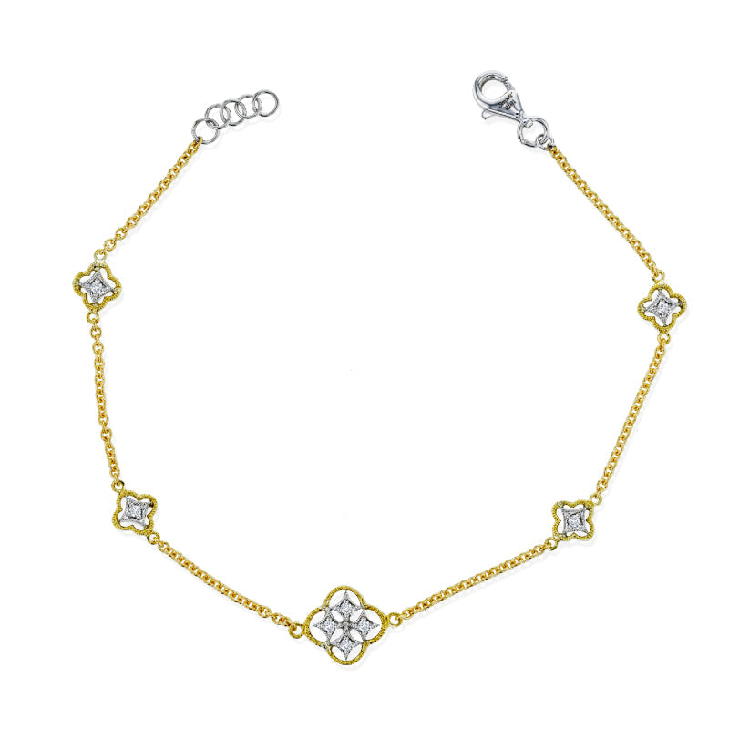 The Simon G. 18K Yellow Gold Diamond Station Bracelet from Simon G features a delicate chain adorned with elegantly spaced, flower-shaped charms. Its silver-colored clasp beautifully complements the slightly larger and more ornate centerpiece charm, adding a touch of sophistication.