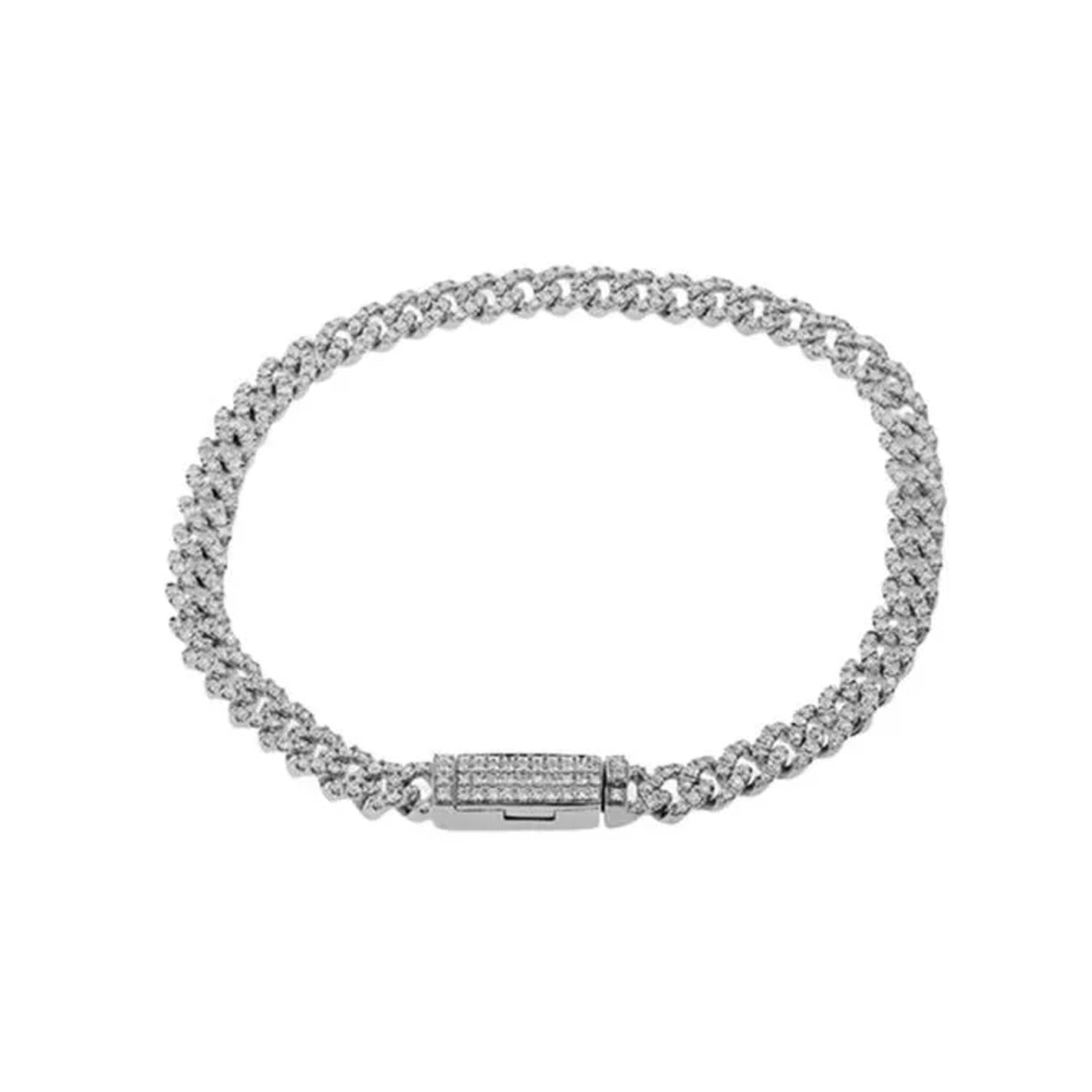 The Simon G. 14K White Gold Diamond Curb Link Chain Bracelet, a dazzling piece featuring a woven design and a clasp adorned with sparkling stones, rests flat against a white background.