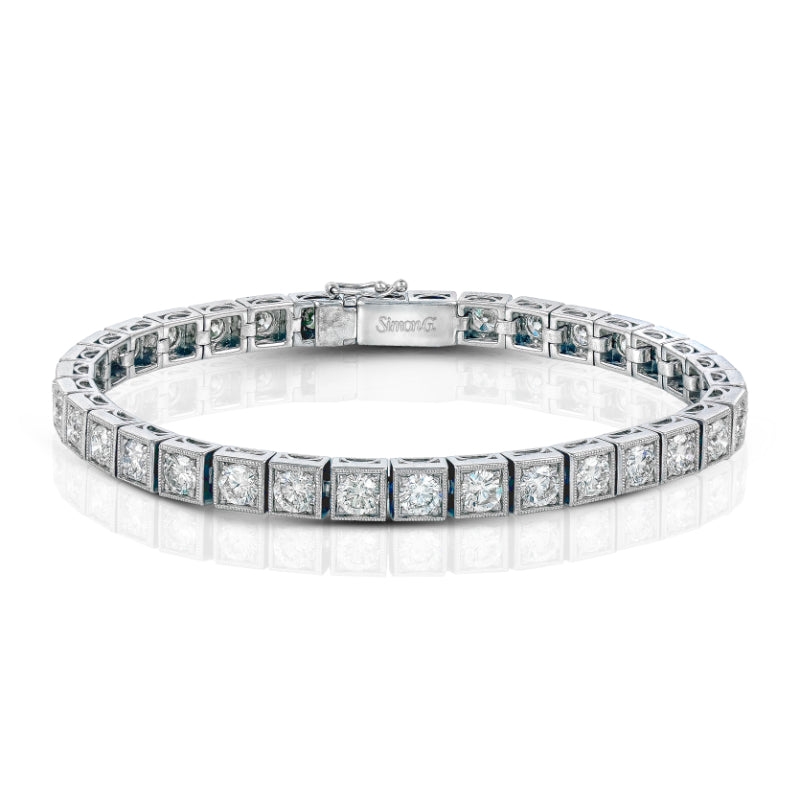 The Simon G. 18K White Gold Diamond Bracelet from Simon G is beautifully showcased on a white background, highlighting its round diamond settings and secure clasp.