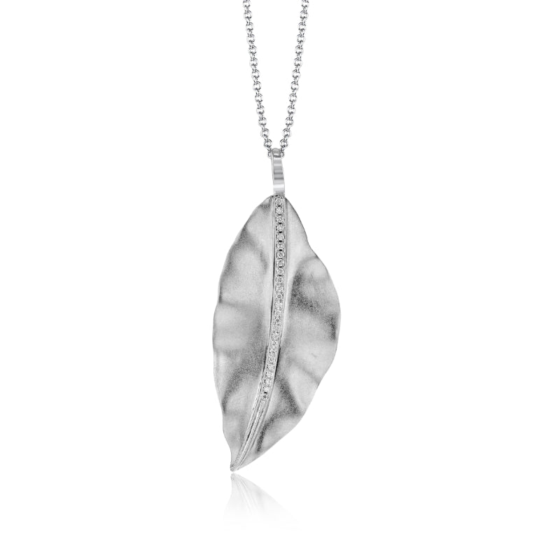 This minimalist jewelry piece, the Simon G. Fallen Leaf 18K White Gold Diamond Necklace Pendant by Simon G, showcases a white gold leaf pendant with a textured surface and central vein. The delicate chain features small, evenly spaced links, while the shiny finish of the pendant gently reflects light.