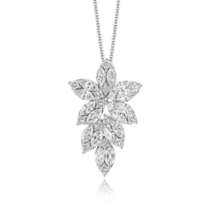 Introducing the Simon G. Leaf 18K White Gold Diamond Necklace Pendant by Simon G, showcasing an exquisite silver necklace adorned with an intricately designed flower-shaped pendant in 18k white gold, embellished with dazzling diamonds, all set against a pristine white background.