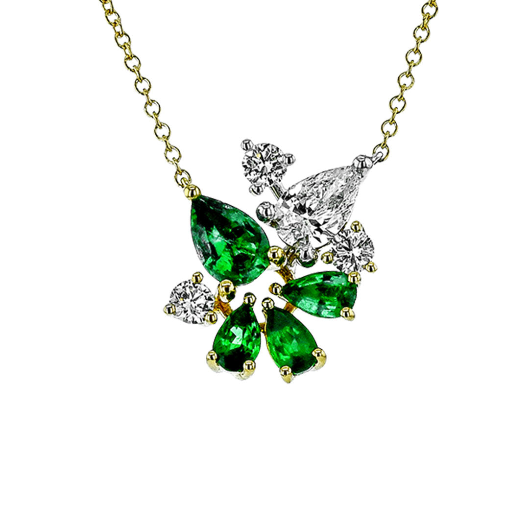 The Simon G. 18K White and Yellow Gold Pear Diamond and Emerald Necklace Pendant showcases teardrop-shaped emeralds, pear diamond accents, and round diamonds in a floral design.