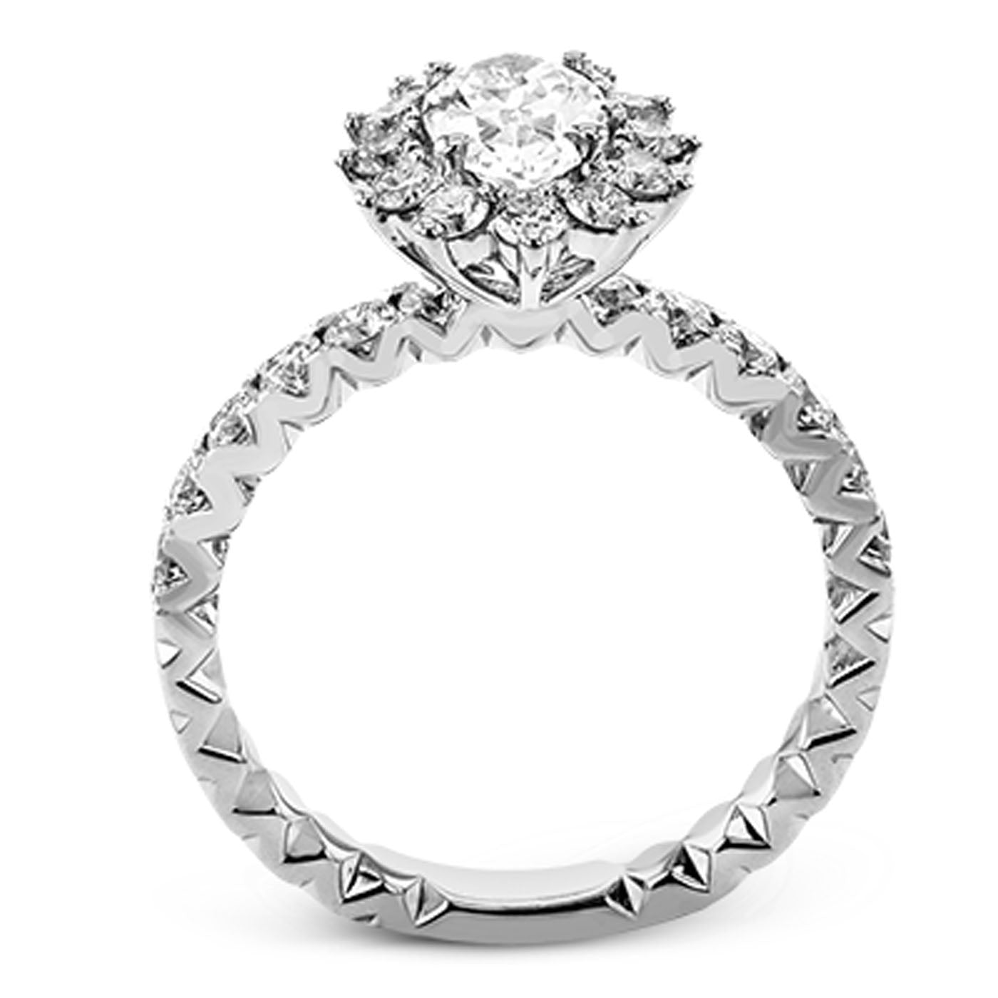 Introducing the Simon G. 18K White Gold Sapphire with Diamond Ring: a stunning engagement piece showcasing a large round diamond encircled by a halo of smaller diamonds, all meticulously arranged on an intricately designed white gold band adorned with an elegant zigzag pattern.