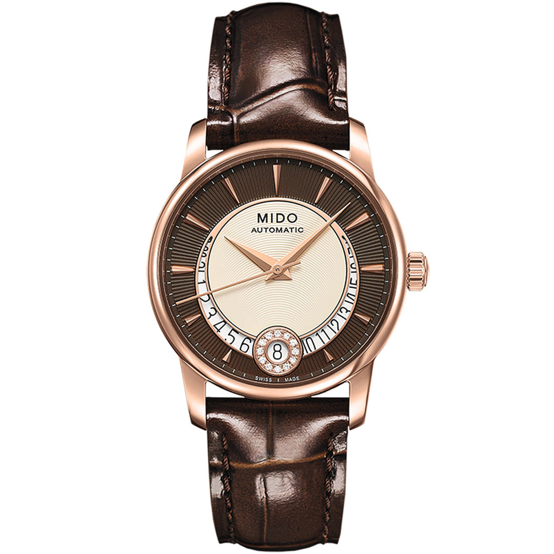 The MIDO Baroncelli II Lady Diamonds Automatic 33mm Watch features a brown leather strap, gold-tone case, round dial with gold hour markers, date at 6 o’clock, and “Mido Automatic” branding for a refined look.