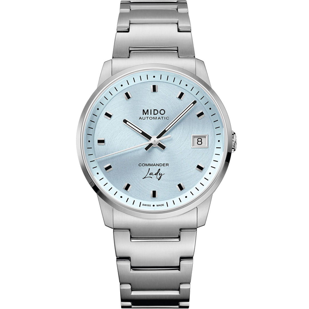 The MIDO Commander Lady Automatic 35mm Watch features a light blue dial, date at 3 o'clock, silver markers, and a stainless steel bracelet—an elegant Swiss luxury timepiece by MIDO for any occasion.
