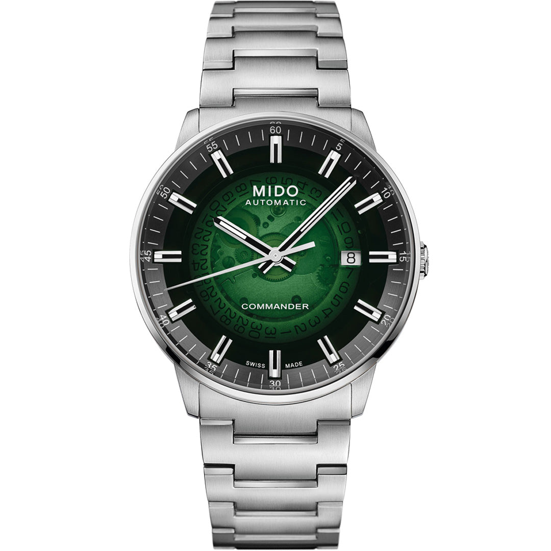 The MIDO Commander Gradient Automatic 40mm Watch features a stainless steel band, green transparent acrylic dial with white hour markers, Caliber 80 movement, date at 3 o’clock, and “AUTOMATIC” and “COMMANDER” on the face.