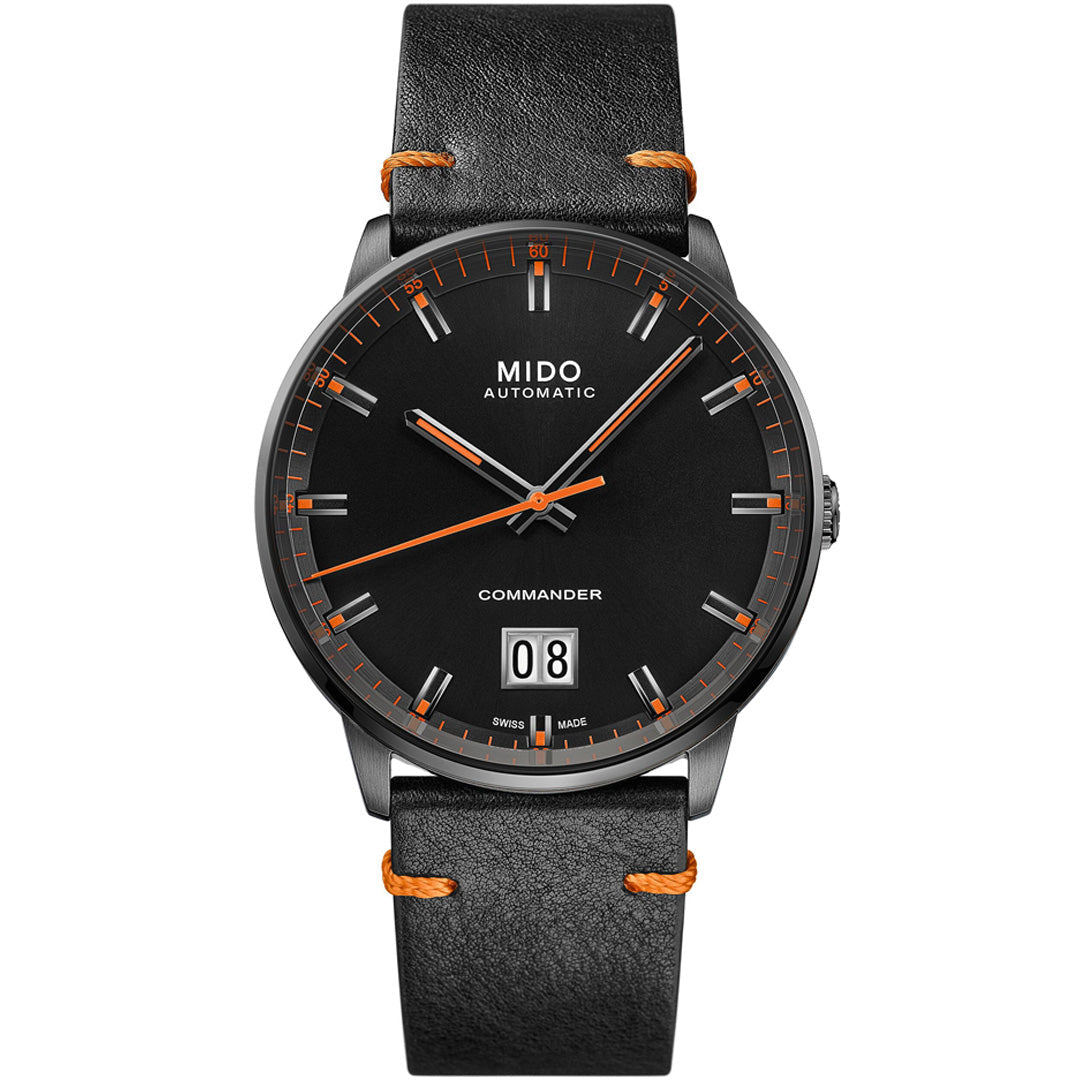 The MIDO Commander Big Date Automatic 42mm Watch features a black dial with orange accents, a black leather strap, silver hour markers, large date at 6 o’clock, “MIDO AUTOMATIC” and “COMMANDER” on the dial, and a Caliber 80 movement.