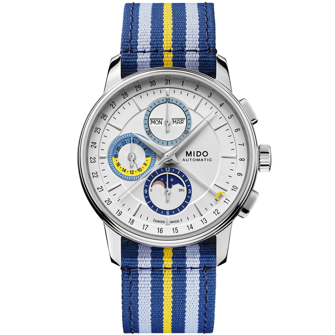 The MIDO Baroncelli Chronograph Moonphase Automatic 42mm features a silver case, blue/yellow/white striped fabric strap, and a white dial with blue and yellow-accented subdials for day, month, and 24-hour time.