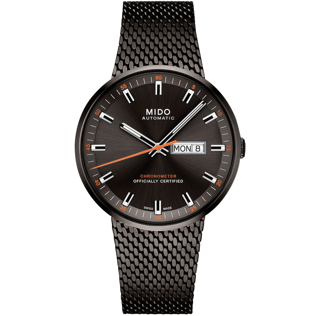 The MIDO Commander Icône Automatic 42mm Watch features a black mesh strap, sunburst black dial, silver hour markers, orange accents, day-date window at 3 o’clock, and "CHRONOMETER OFFICIALLY CERTIFIED" on the face. COSC-certified chronometer.