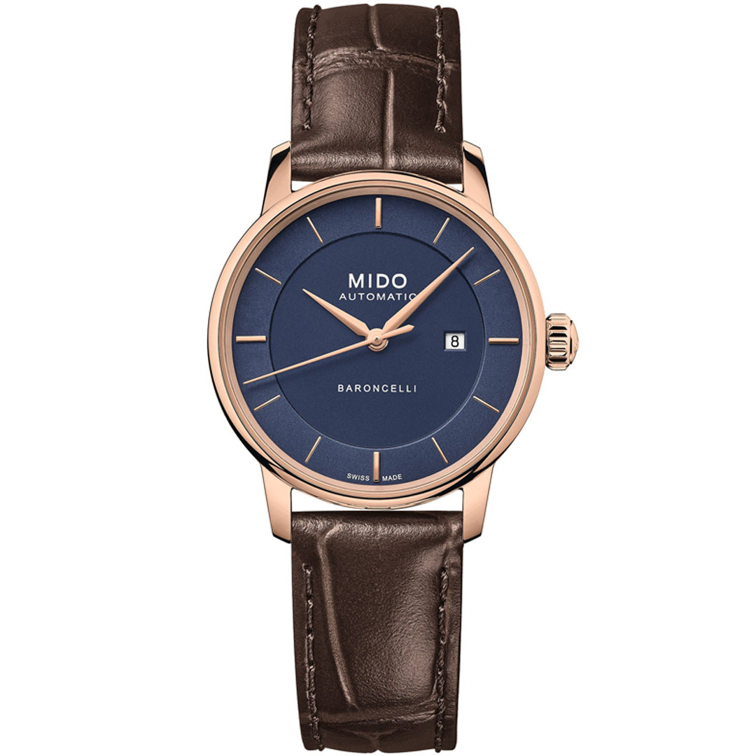 The MIDO Baroncelli II Signature Lady Automatic 30mm watch features a blue dial, gold-tone case, brown leather strap, date at 3 o'clock, minimal hour markers, and a slim second hand for an elegant look.