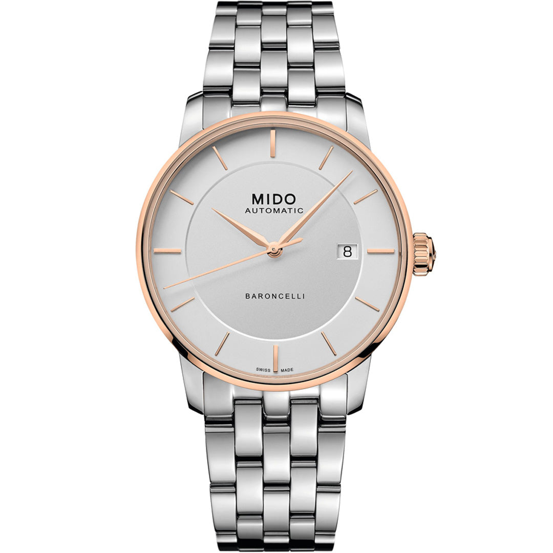 The MIDO Baroncelli II Signature Gent Automatic 39mm Watch features a silver metal band, white dial with gold accents, date display at 3 o’clock, and a minimalist design with slim hour markers and hands for an elegant look.
