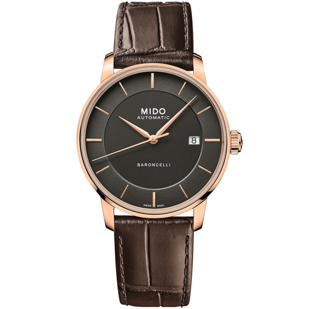 The MIDO Baroncelli II Signature Gent Automatic 39mm watch features a round brown dial, gold case, date at 3 o’clock, and a brown crocodile-pattern leather strap.
