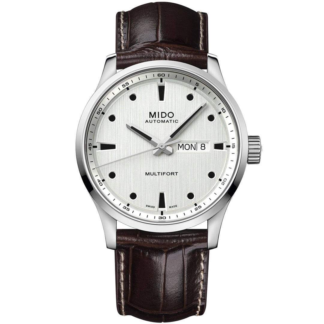 The MIDO Multifort M Automatic 42mm Watch features a silver-toned case and hands, white dial with black markers, day/date display, Caliber 80 movement, and a brown leather strap.