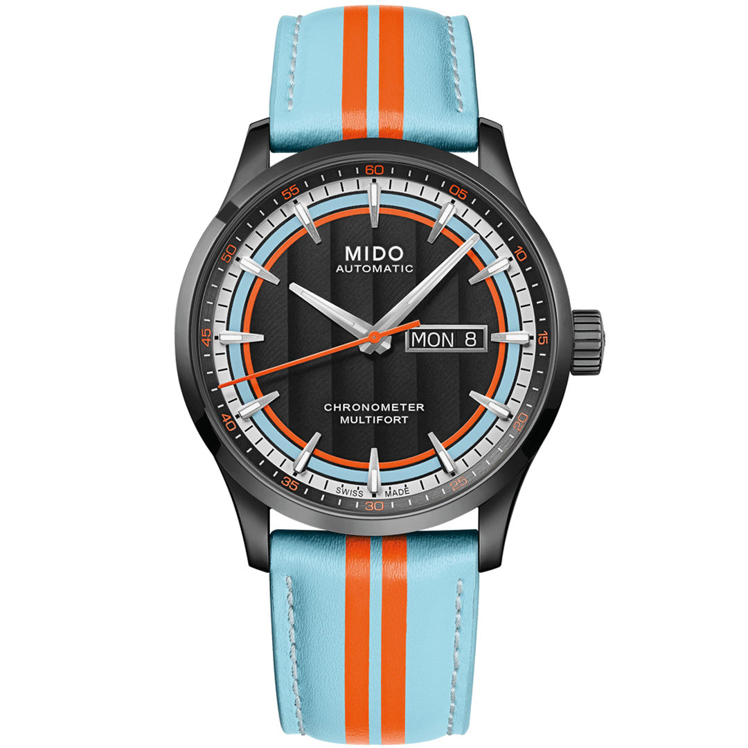 The MIDO Multifort Chronometer 1 Racer Automatic 42mm features a black dial with white markers, a blue and orange striped leather strap, "MIDO" and "Automatic" on the face, Caliber 80 SI movement, and day/date display as "MON 8".
