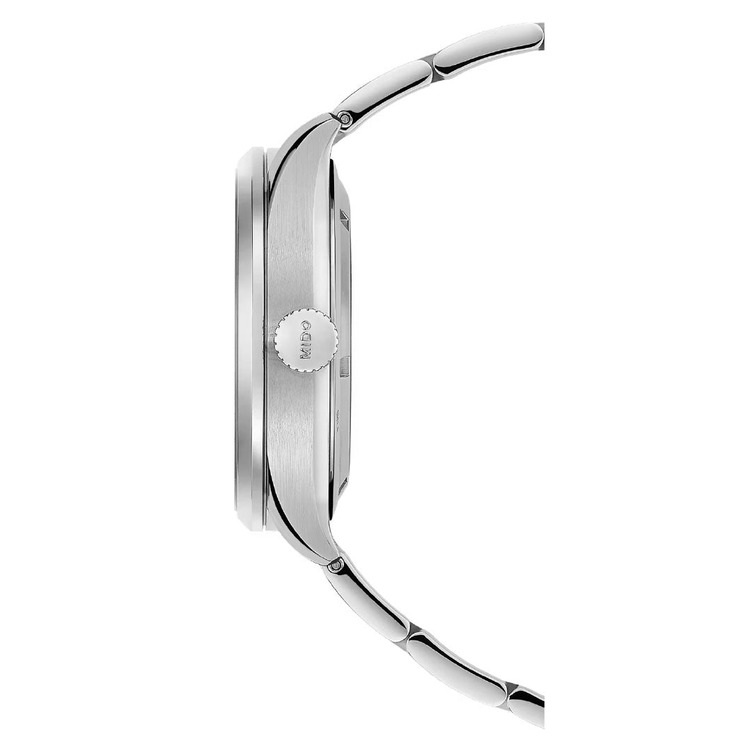 Side view of the MIDO Multifort Skeleton Vertigo Automatic 42mm Watch with a silver metal link band, showcasing the crown and slim automatic case profile by MIDO against a white background.