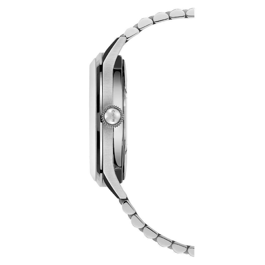 Side view of the MIDO Multifort Patrimony Powerwind Automatic 40mm Watch in silver with a metallic link band, round crown, and slim profile, displayed against a white background.