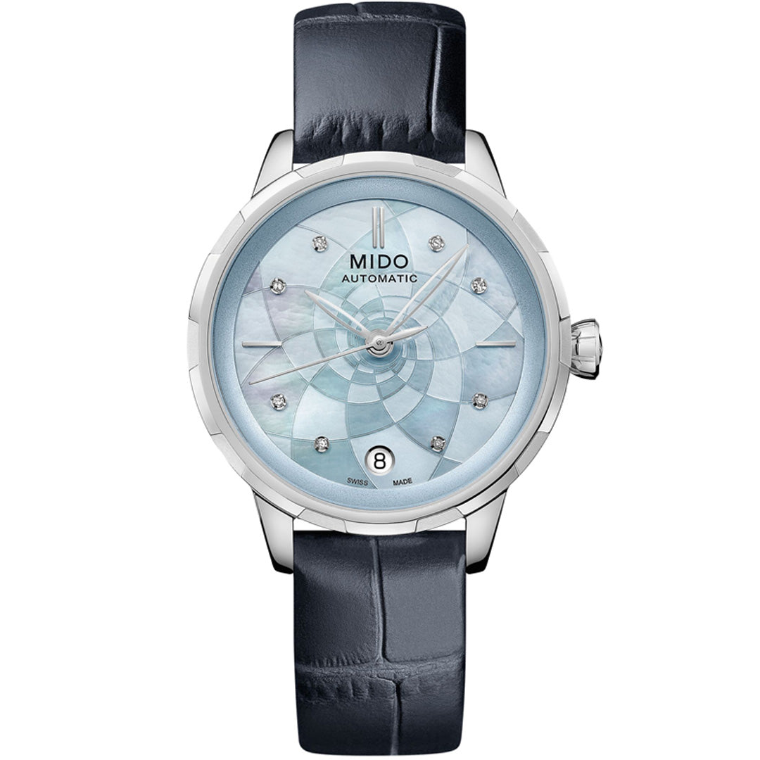 The MIDO Rainflower Automatic 34mm Watch features a light blue mother-of-pearl dial with diamond hour markers, date window at 6 o’clock, a silver-tone case, and black leather strap—an elegant minimalist choice from MIDO's women's collection.