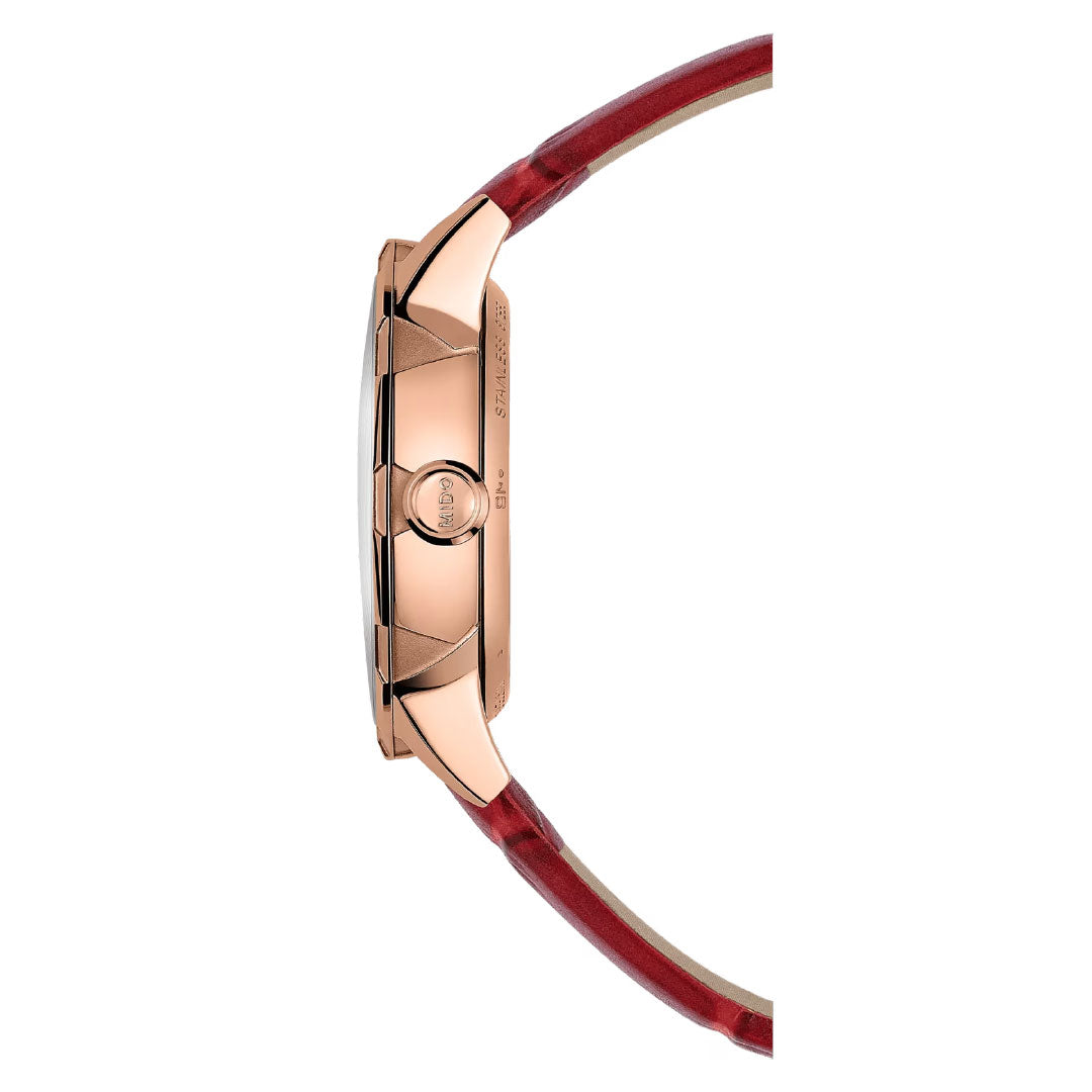 Side view of the MIDO Rainflower Automatic 34mm Watch, featuring a rose gold case and red leather strap, highlights its crown and slim profile against a white background—a striking women's timepiece from MIDO.
