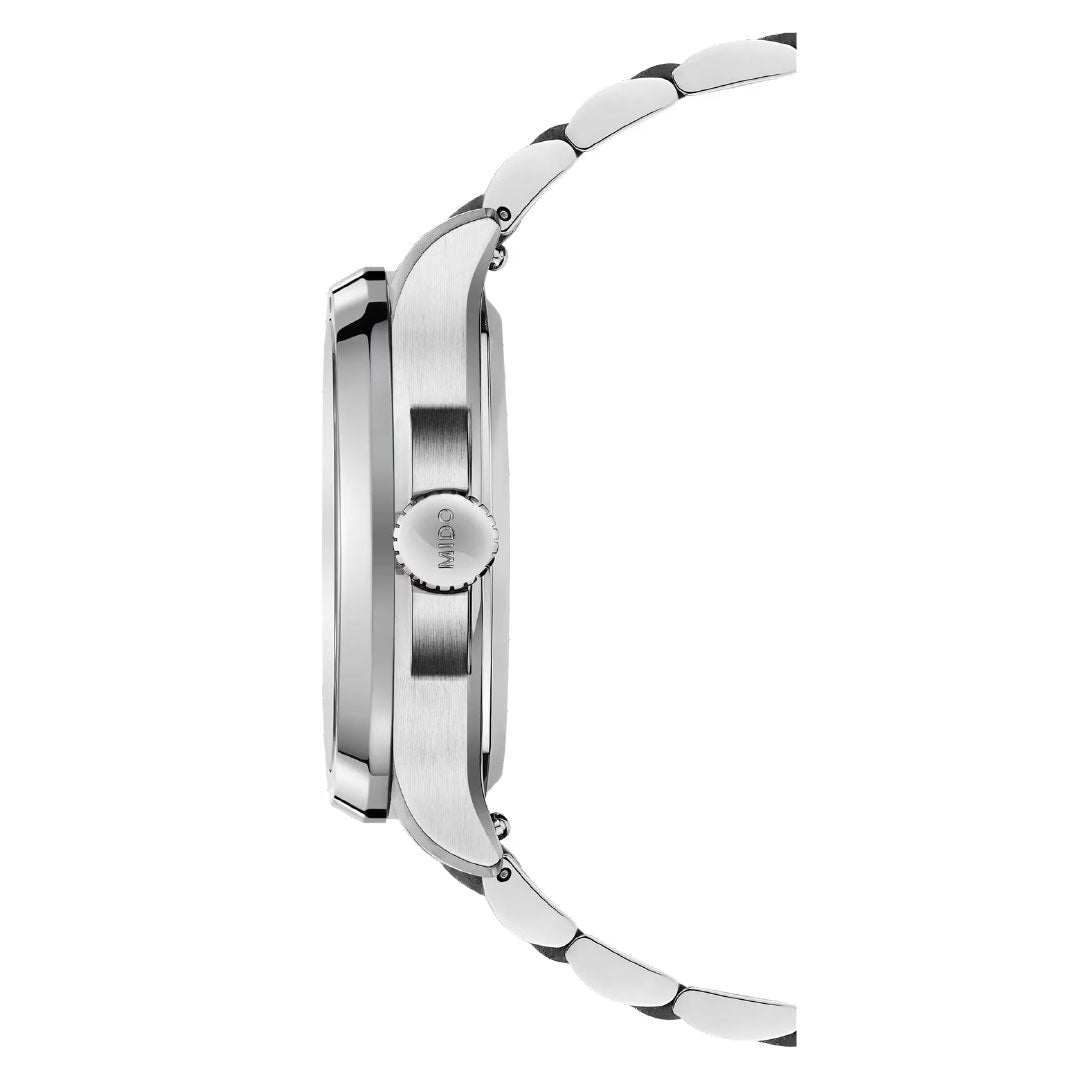 Side view of the MIDO Multifort TV Big Date Automatic 40mm Watch in silver metal with a round case, smooth bezel, and link bracelet. The "MIDO"-engraved crown appears on the right—showcasing Swiss craftsmanship.