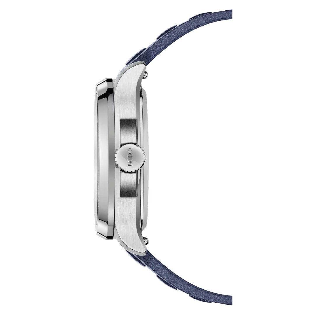 Profile view of the MIDO Multifort TV Big Date Automatic 40mm Watch, featuring a silver metal case, round crown with MIDO branding, and a blue leather strap. The watch face is not visible in this side angle shot.